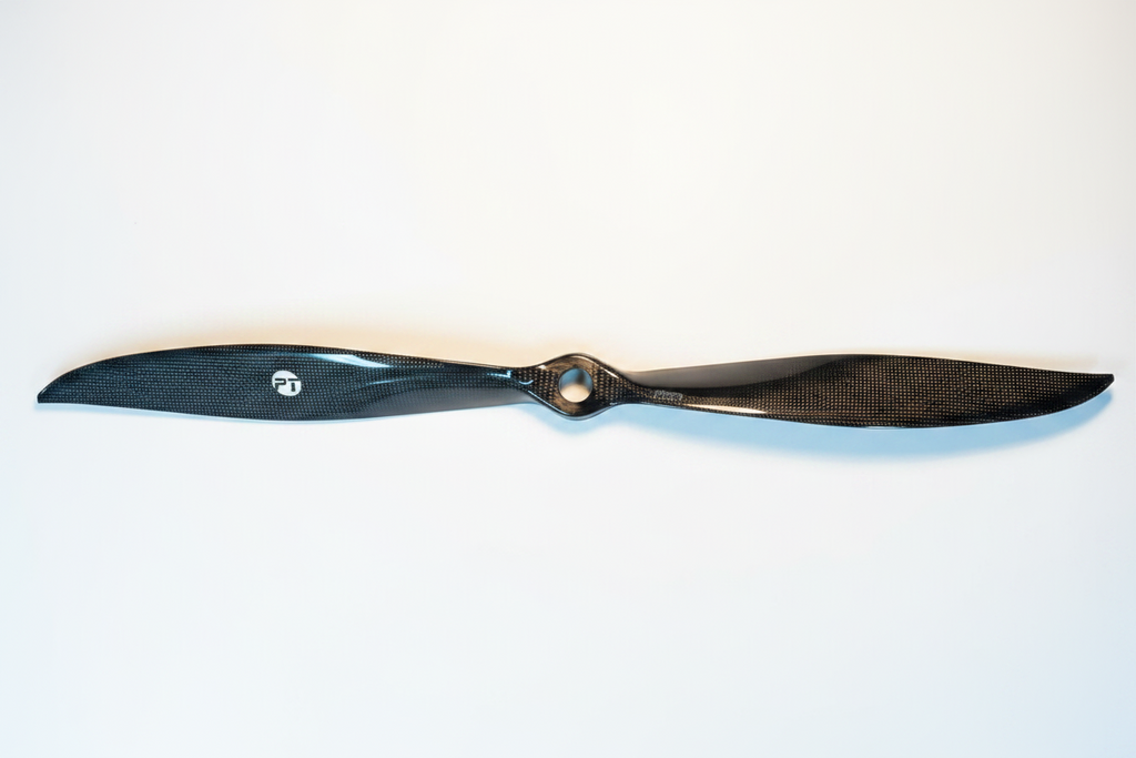PT Model 23x20 rear contra carbon fibre propeller full length on white studio background