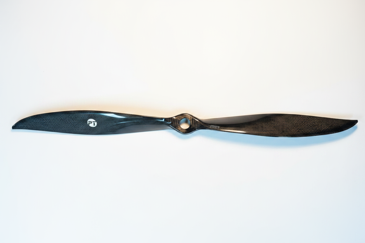 PT Model 23x20 rear contra carbon fibre propeller full length on white studio background