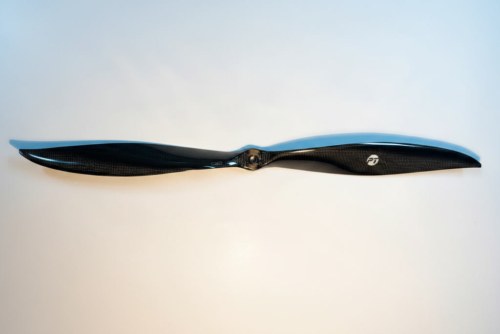 PT Model 23x20 front contra carbon fibre propeller full length portrait view showing both blades, hub and PT Model logo on white studio background